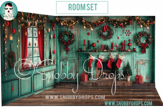 Teal Christmas room set backdrop with fireplace, stockings, wreaths, and wrapped gifts.