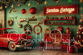 Vintage Santa's Garage backdrop with red classic car, neon sign, tools, and Christmas tree.